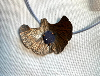 Hand forged copper ginko leaf with druzy, leather cord